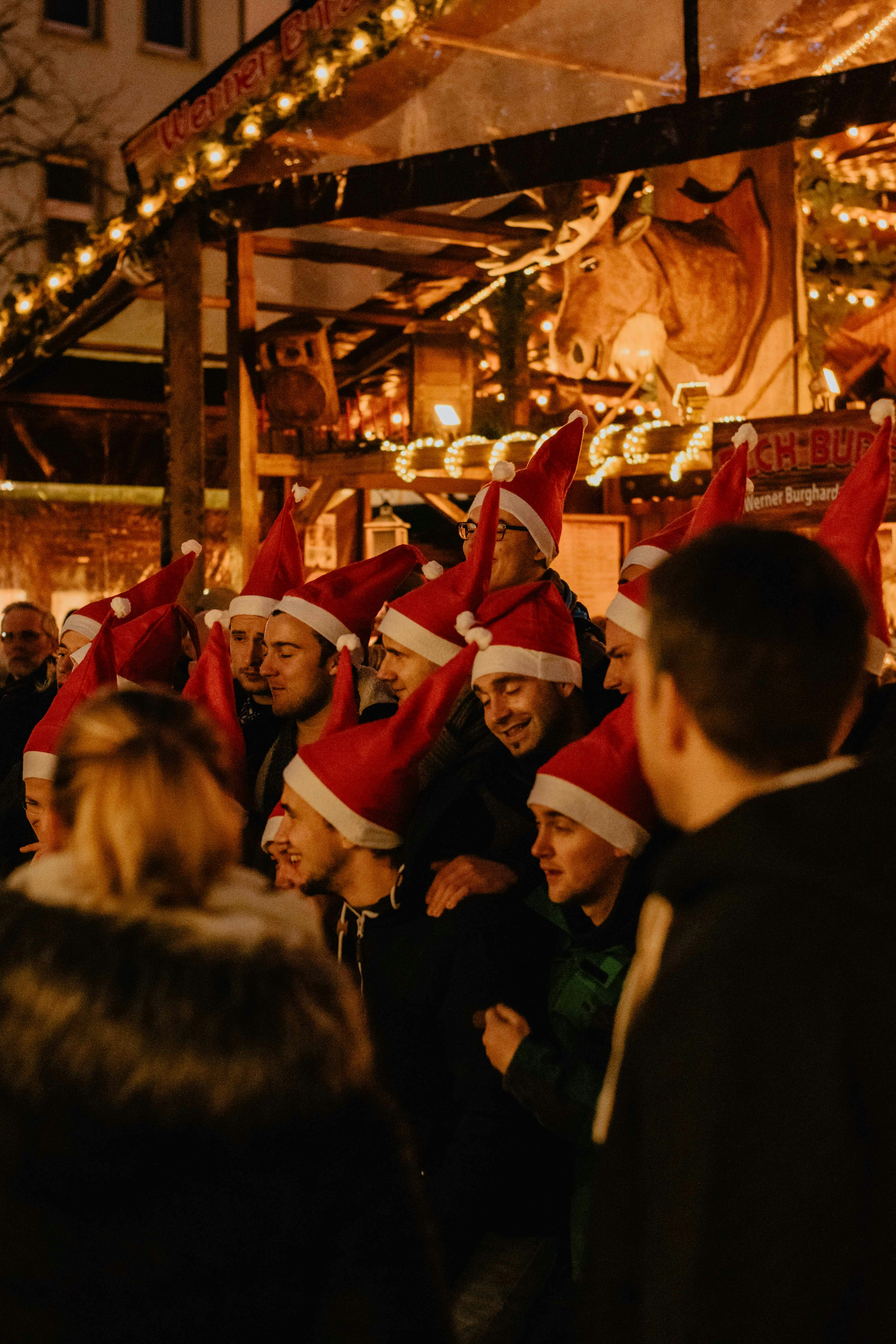 people wearing Santa Claus hat